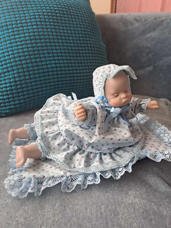 Vintage music and moving porcelain baby doll