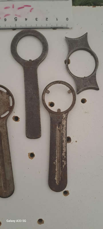 Set of 9 various vintage case back openers