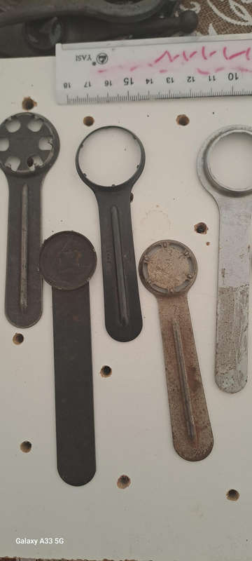 Set of 9 various vintage case back openers