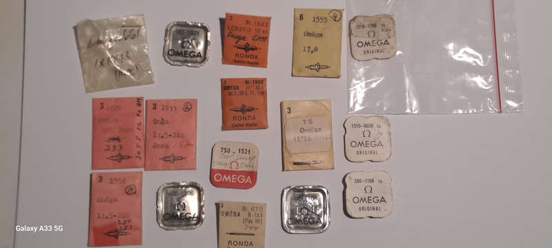 various vintage Omega watch parts