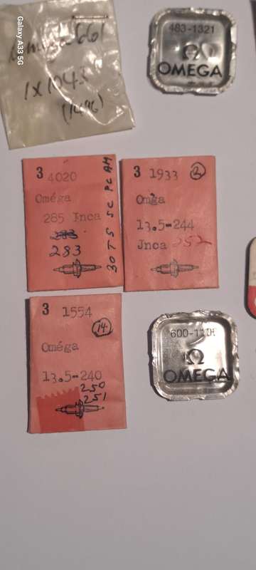 various vintage Omega watch parts