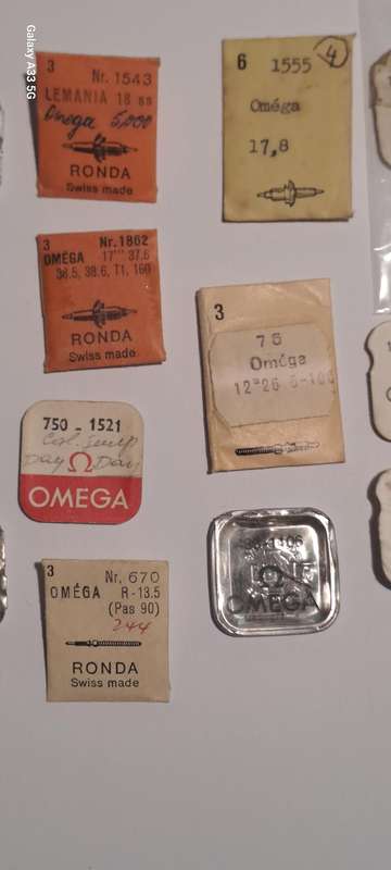 various vintage Omega watch parts