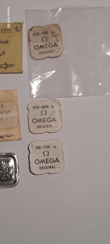 various vintage Omega watch parts