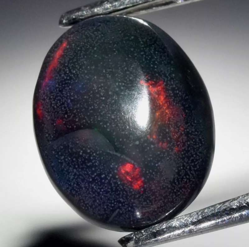 1.25ct Oval Natural Play-Of-Colour Crystal Black Opal