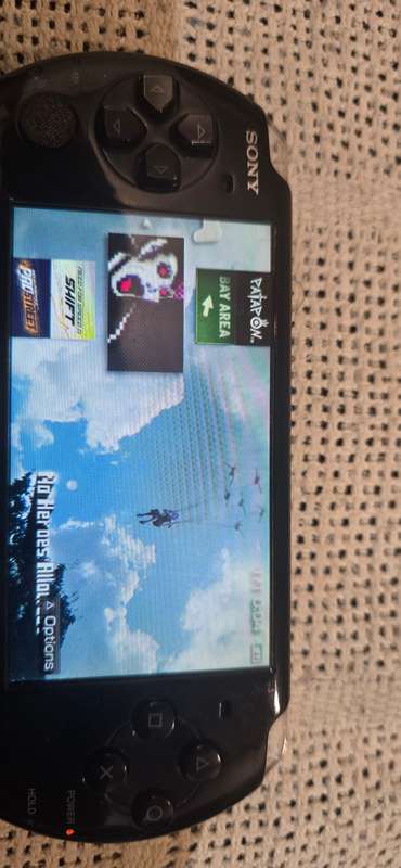 listing 1 PSP 3000 modded 64gb 60+games loaded