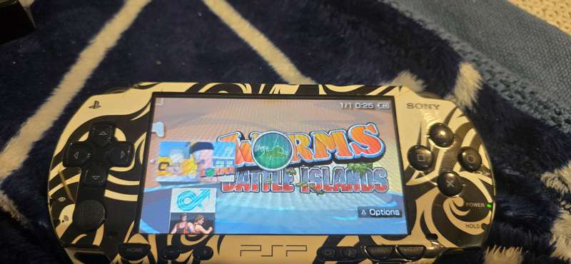 listing 1 PSP 1000 modded 64gb 60+games whiteames loaded
