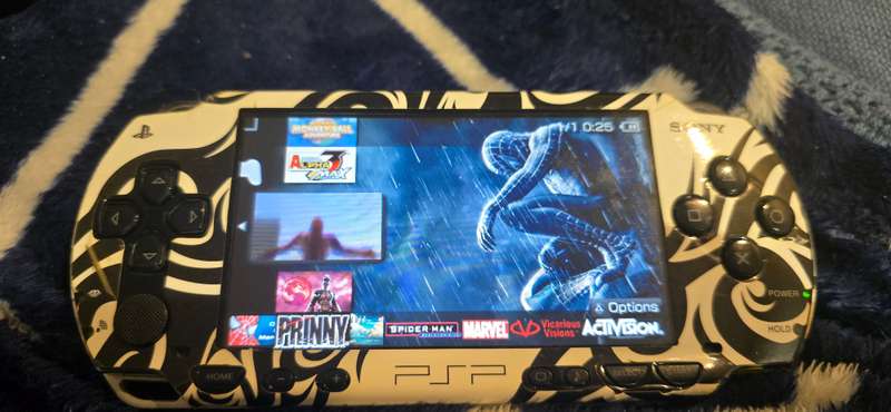 listing 1 PSP 1000 modded 64gb 60+games whiteames loaded