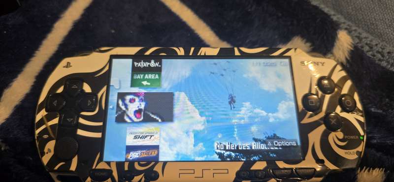 listing 1 PSP 1000 modded 64gb 60+games whiteames loaded