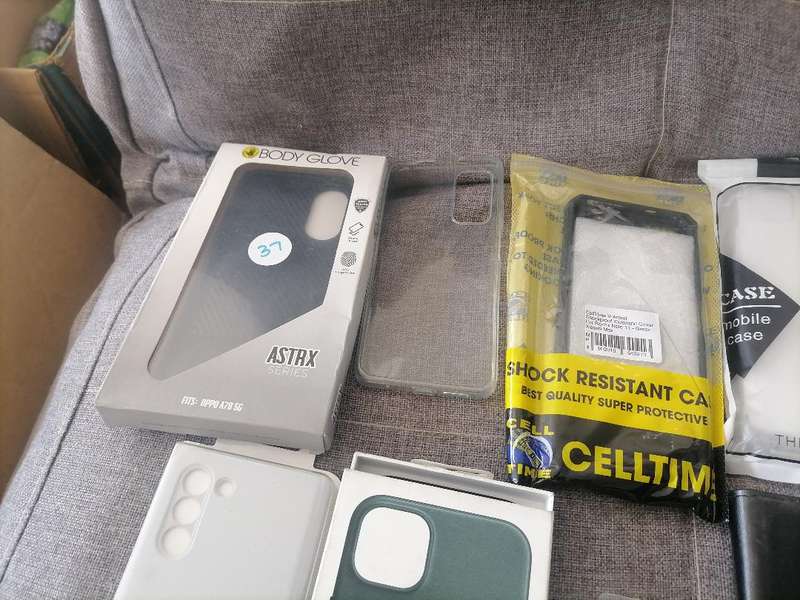LOT OF APPLE PHONE, TABLET,NEW PHONE COVERS , ETC, ONE BID FOR THE LOT*