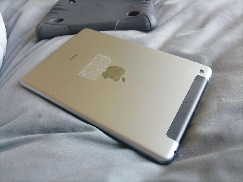 Apple iPad A1490 with pouch, front glass cracked. Sold as is.
