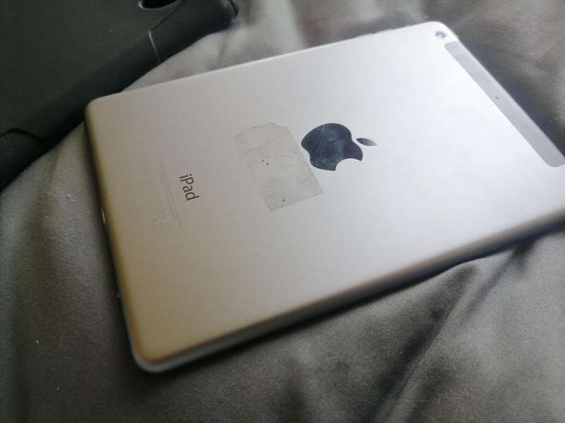 Apple iPad A1490 with pouch, front glass cracked. Sold as is.
