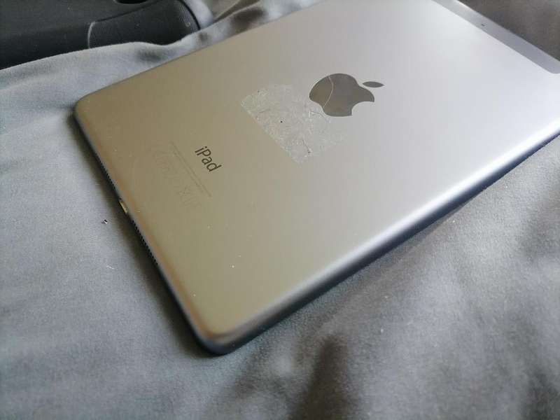Apple iPad A1490 with pouch, front glass cracked. Sold as is.