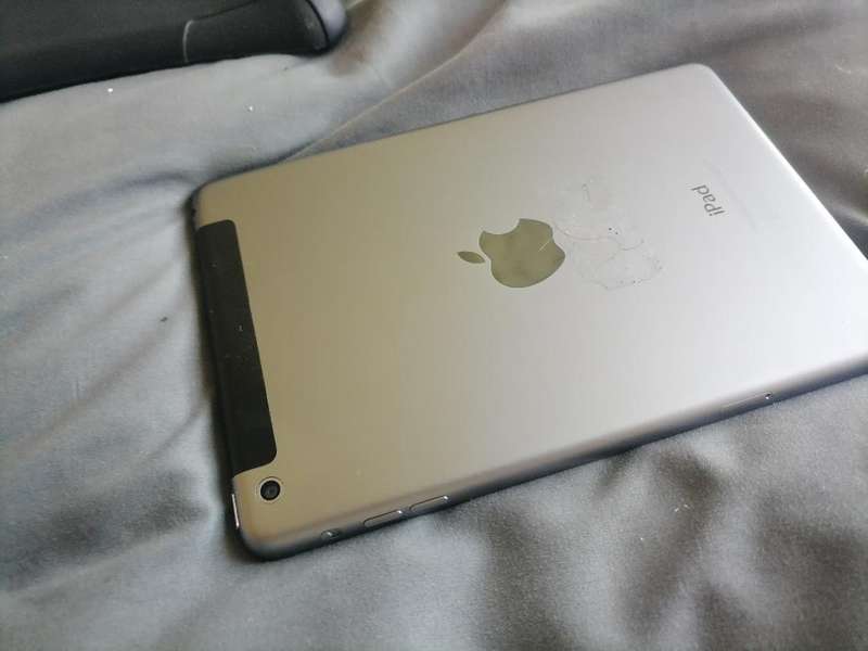Apple iPad A1490 with pouch, front glass cracked. Sold as is.