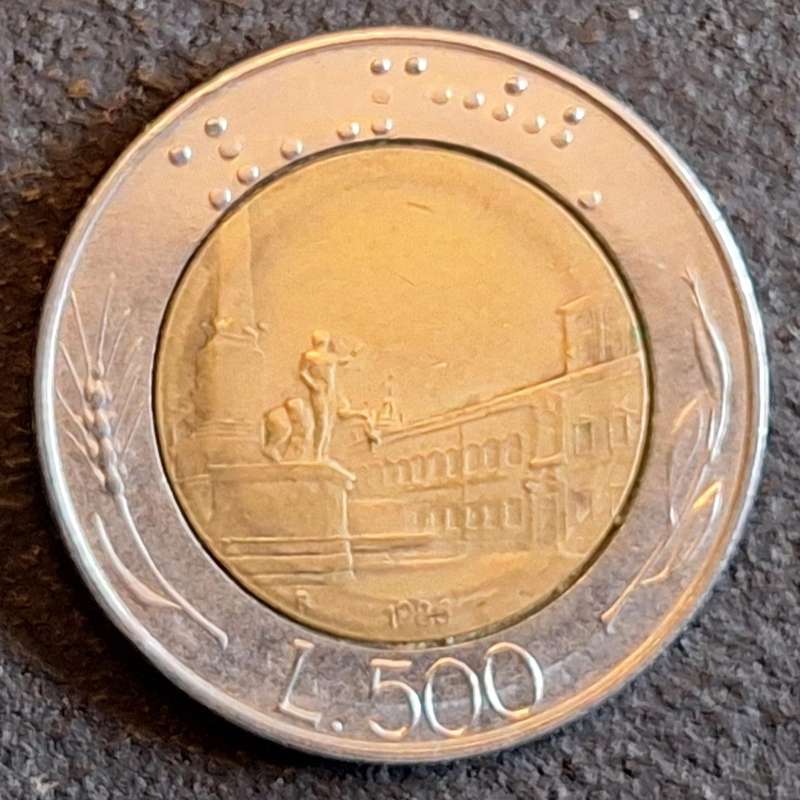 Italy 1986 500 Lire Bimetallic: bronzital center in acmonital ring