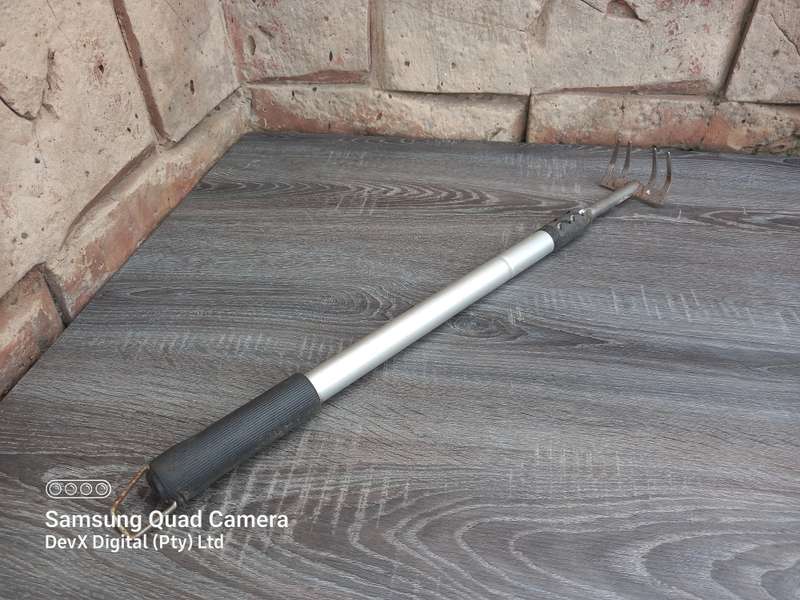 Compact Silver Garden Rake  Extendable Design for Easy Gardening - Durable Silver Finish
