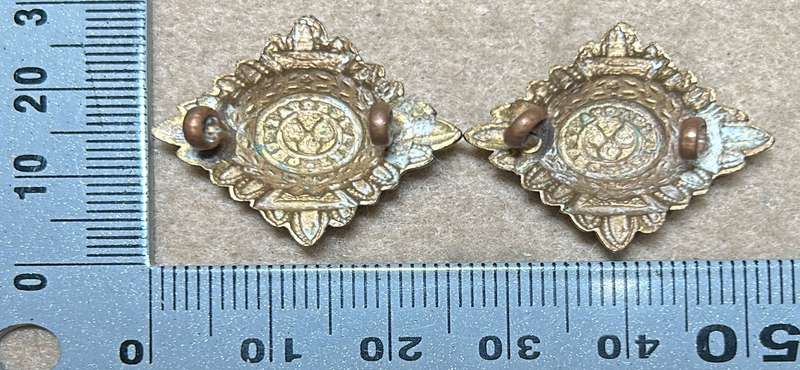 RHODESIA CROWNS AND PIPS - 2 BRASS PIPS WITH RED ENAMEL