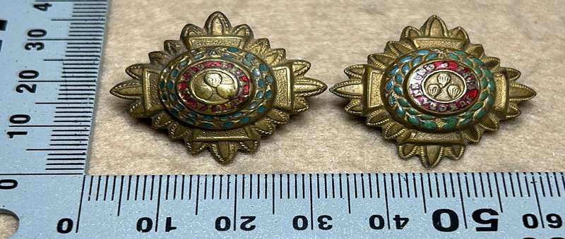 RHODESIA CROWNS AND PIPS - 2 BRASS PIPS WITH RED ENAMEL