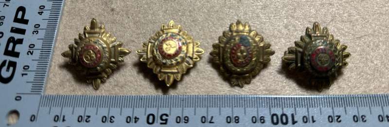 RHODESIA CROWNS AND PIPS - 4 BRASS PIPS WITH RED ENAMEL