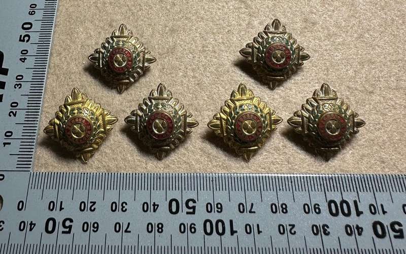 RHODESIA CROWNS AND PIPS - 6 BRASS PIPS WITH RED ENAMEL