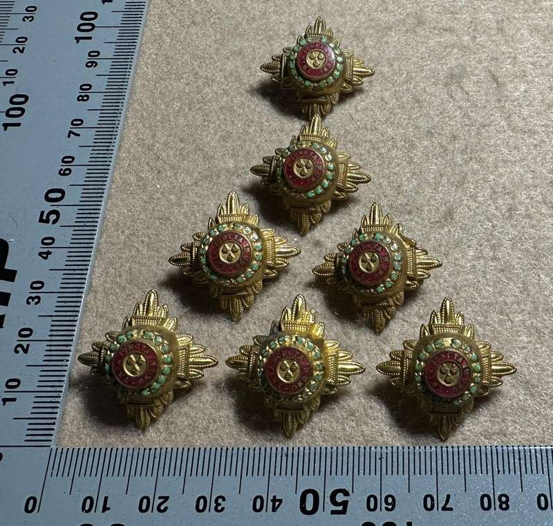 RHODESIA CROWNS AND PIPS - 7 BRASS PIPS WITH RED ENAMEL