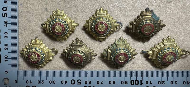 RHODESIA CROWNS AND PIPS - 7 BRASS PIPS WITH RED/GREEN ENAMEL