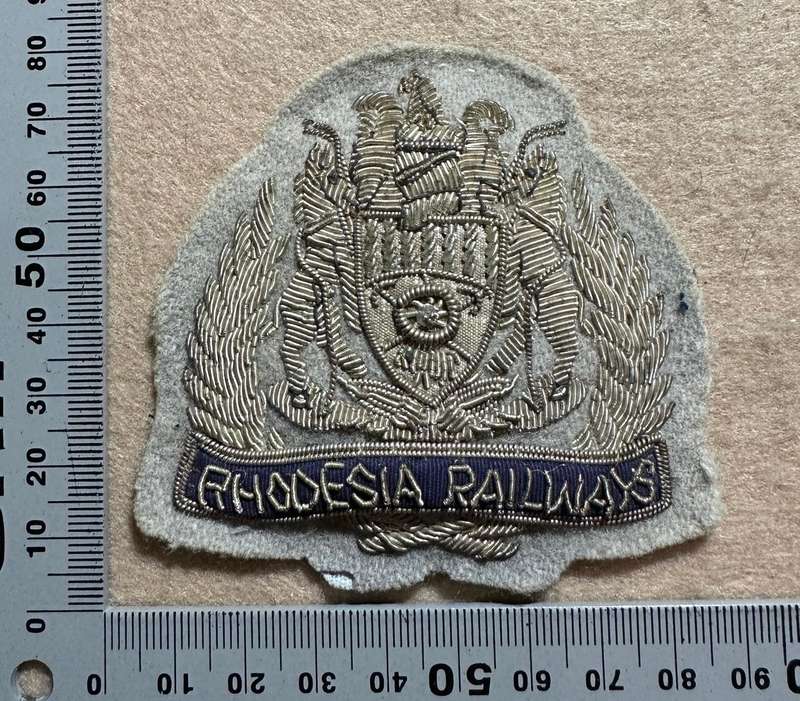 Rhodesian Railways - BULLION SILVER ON GREY CAP BADGE