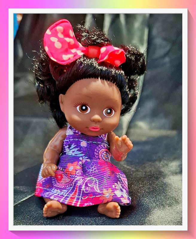 Take it anywhere pocket size curly hair doll