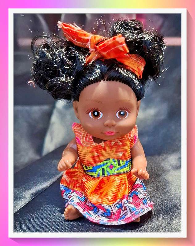 Pop it in your pocket curly hair doll
