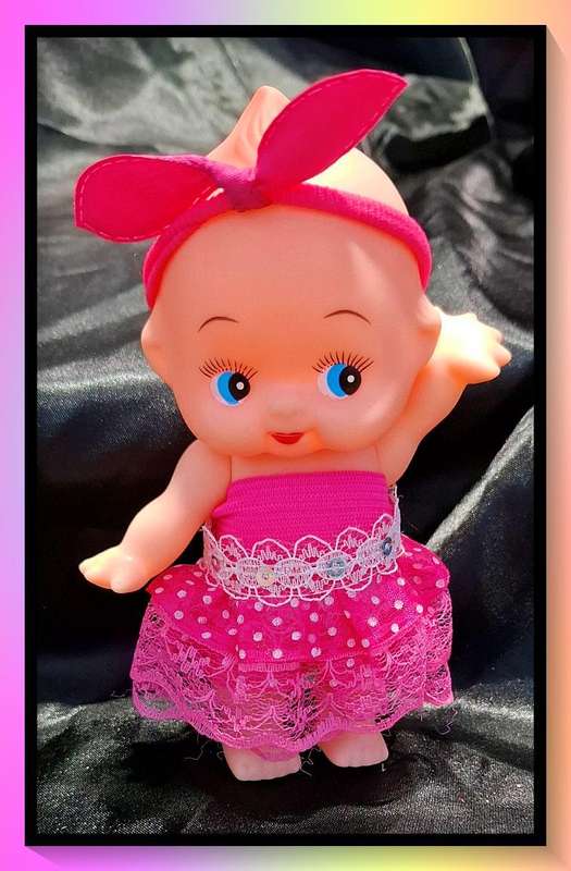 Adorable kewpie style doll with custom made outfits