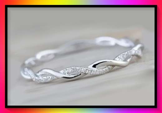 Elegant petite intertwined silver tone ring size: 10