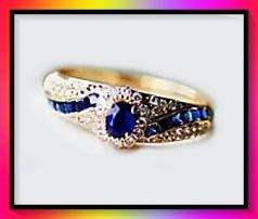 Stunning Sapphire simulant set in yellow gold tone ring size 9