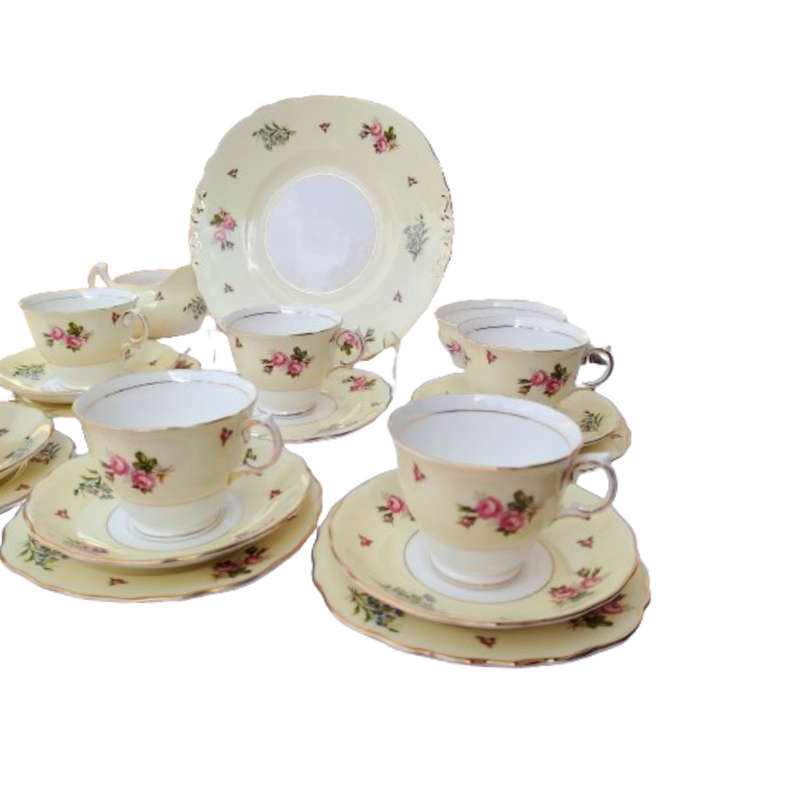 Colclough Tea Set Pale Yellow Bands decorated with colorful flowers