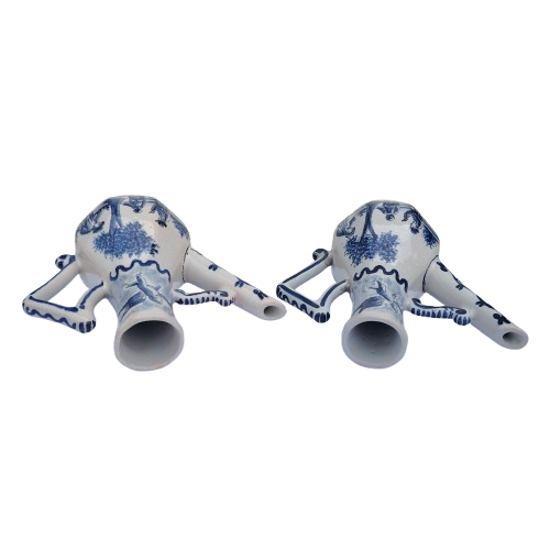 Blue and white faience wares pair of condiment ewers and twin-bowl