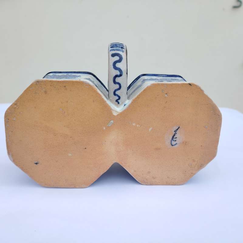 Blue and white faience wares pair of condiment ewers and twin-bowl