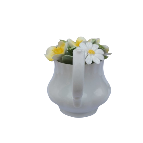 Royal Doulton bone china teapot pot with a flower arrangement on top