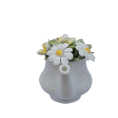 Royal Doulton bone china teapot pot with a flower arrangement on top