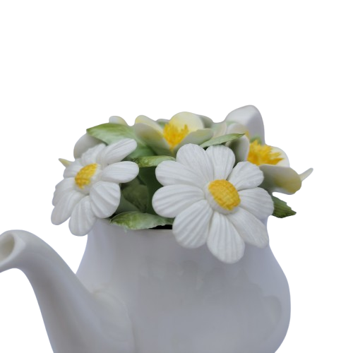 Royal Doulton bone china teapot pot with a flower arrangement on top