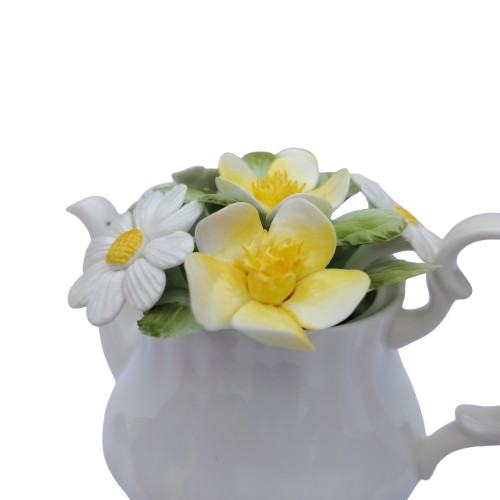 Royal Doulton bone china teapot pot with a flower arrangement on top