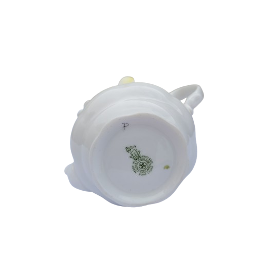 Royal Doulton bone china teapot pot with a flower arrangement on top