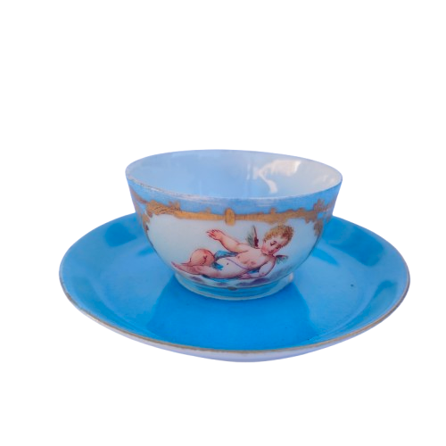 Lovely antique azure blue cherub cup and saucer in Sevres style.