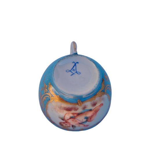 Lovely antique azure blue cherub cup and saucer in Sevres style.
