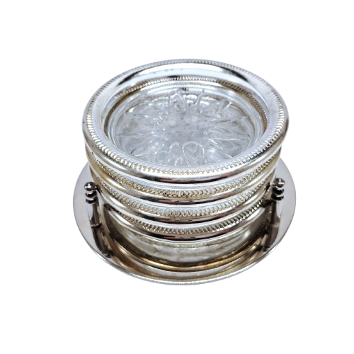 Set of four cut glass and silver coasters in stand
