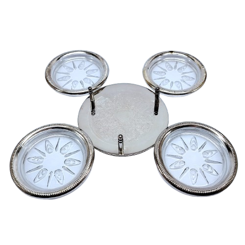 Set of four cut glass and silver coasters in stand
