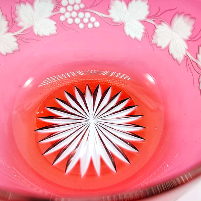 Beautiful engraved cranberry glass bowl decorated with fruiting vine