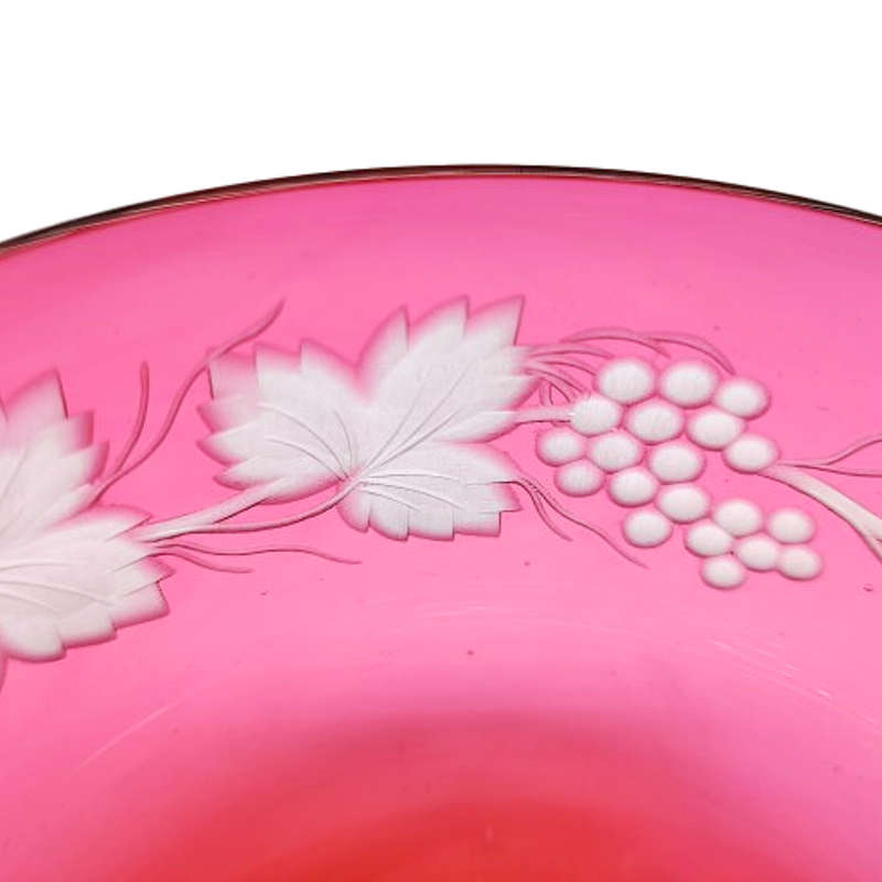 Beautiful engraved cranberry glass bowl decorated with fruiting vine