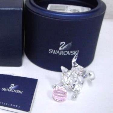 Swarovski Crystal Kitten is playing with a pink ball of wool