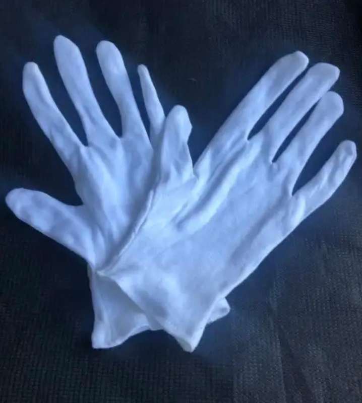 White cotton gloves.