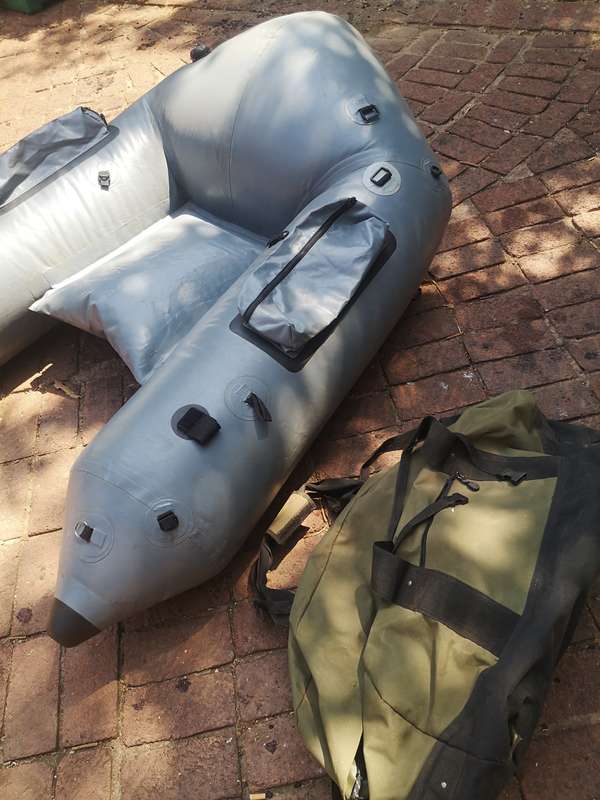 HEAVY DUTY INFLATABLE BASS FISHING BOAT WITH BAG (RUBBER DUCK) STILL NEW NEVER USED