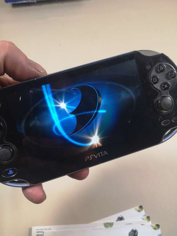 Complete PS Vita With Charge Cable, Booklets, Game and Original Box