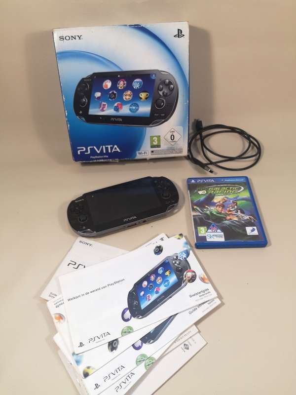 Complete PS Vita With Charge Cable, Booklets, Game and Original Box